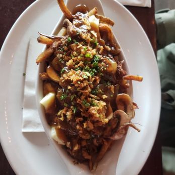 Leopold's Tavern - Beef short rib breakfast poutine. On the salty side, but super delicious and would be great hangover food, haha - Burgers Near Me - Saskatoon, Saskatchewan Leopold's Tavern - Beef short rib breakfast poutine. On the salty side, but super delicious and would be great hangover food, haha - Burgers Near Me - Saskatoon, Saskatchewan