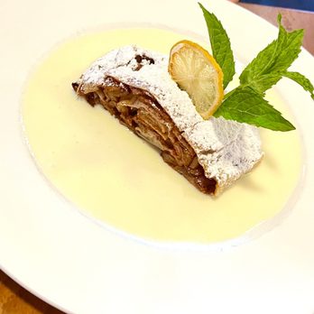 The Station 100 - Apple strudel with vanilla cream sauce - Steakhouses Near Me - Frankenmuth, Michigan The Station 100 - Apple strudel with vanilla cream sauce - Steakhouses Near Me - Frankenmuth, Michigan