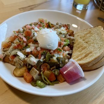 The Egg & Us - Mexican Breakfast Skillet with dry sourdough toast - Breakfast & Brunch Near Me - Issaquah, Washington The Egg & Us - Mexican Breakfast Skillet with dry sourdough toast - Breakfast & Brunch Near Me - Issaquah, Washington