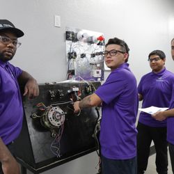 HVAC students are working together on electrical motor wiring in NCC's HVAC lab.