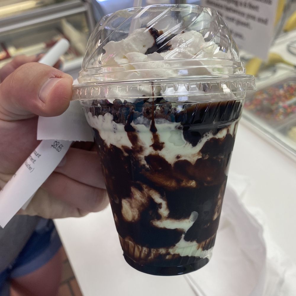 Carvel - a hand holding a cup of ice cream - Ice Cream & Frozen Yogurt Near Me - North Miami Beach, Florida