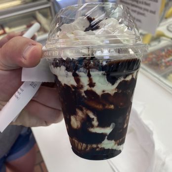 Carvel - a hand holding a cup of ice cream - Ice Cream & Frozen Yogurt Near Me - North Miami Beach, Florida