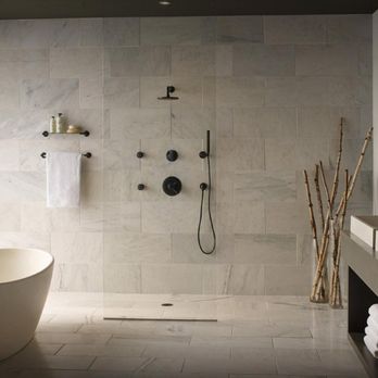 Ny Built - a bathtub in a bathroom with a view of the city - General Contractors Near Me - New York, New York Ny Built - a bathtub in a bathroom with a view of the city - General Contractors Near Me - New York, New York