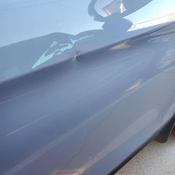 Moreno's Auto Body - Dent and scratches aligned with my neighbor's red SUV driver's door - Body Shops Near Me - North Hollywood, California