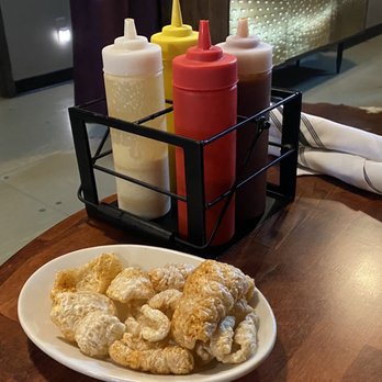 OMC Smokehouse - Complimentary Pork rinds with a selection of various bbq sauces - Barbeque Near Me - Duluth, Minnesota