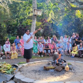 Toa Luau - Sharing how family participates in preparing dinner. Men usually the ones cooking - Cultural Center Near Me - Haleiwa, Hawaii Toa Luau - Sharing how family participates in preparing dinner. Men usually the ones cooking - Cultural Center Near Me - Haleiwa, Hawaii