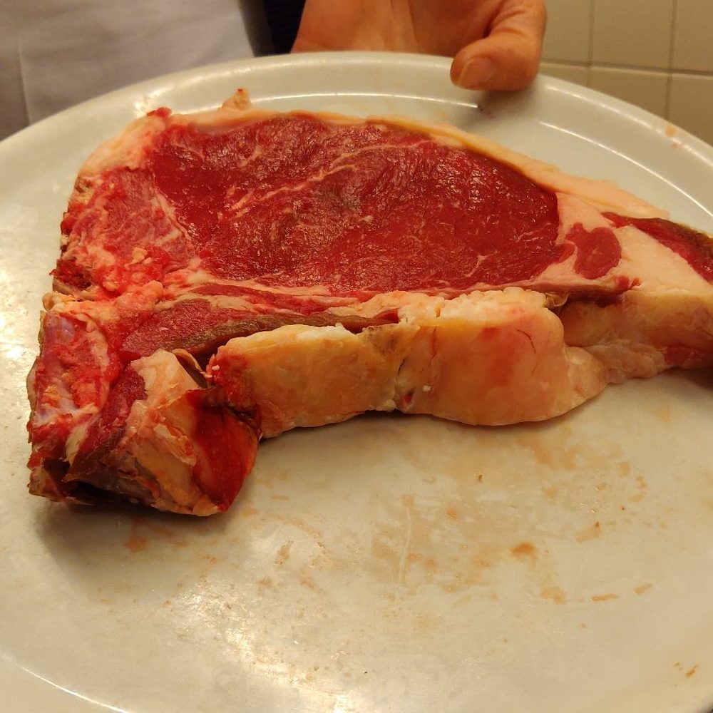 Trattoria Mario - They show you your steak before they cook it for you for sizing - Tuscan Near Me - Florence, FI Trattoria Mario - They show you your steak before they cook it for you for sizing - Tuscan Near Me - Florence, FI