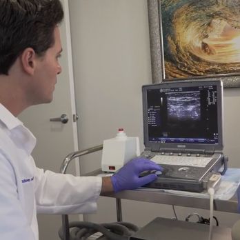 Oceana Vein Specialists - Dr. Isadore performing a diagnostic doppler ultrasound in our Oceanside, CA office. - Vascular Medicine Near Me - Oceanside, California Oceana Vein Specialists - Dr. Isadore performing a diagnostic doppler ultrasound in our Oceanside, CA office. - Vascular Medicine Near Me - Oceanside, California