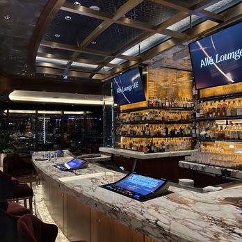 Alle on 66 - One side of the bar with gaming (kind of tacky imo for a luxe cocktail lounge) - Lounges Near Me - Las Vegas, Nevada