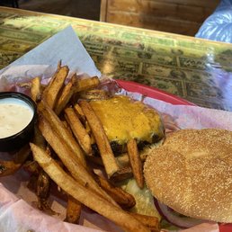 Cheese burger that was blackened with fries Cheese burger that was blackened with fries