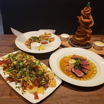 Yard House - Onion ring tower, fried calamari, poke nacho, ahi tuna - New American Near Me - San Jose, California Yard House - Onion ring tower, fried calamari, poke nacho, ahi tuna - New American Near Me - San Jose, California