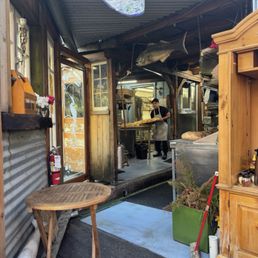 Charming prep area with all their fresh baked goods right off their cozy (dog friendly) covered patio area. My kids loved the Koi pond.