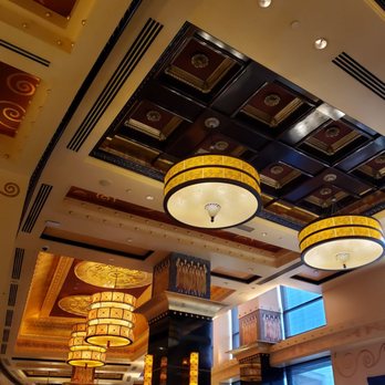 Grand Lux Cafe - Subtle Pillar Artwork, More Vaulted Ceilings, & Chandeliers add such an Elegance - American Near Me - Paramus, New Jersey