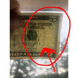 Dollar King - Example of what I showed her. When you can see that 5 in the back like that, that's one way to tell the bill isn't fake.
