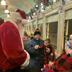 Railtown 1897 State Historic Park - Santa handing out the first gift of Christmas.