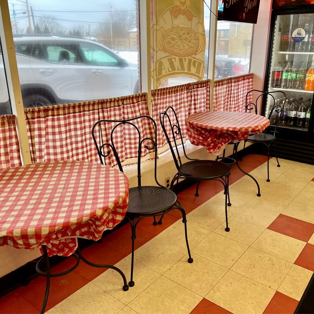 Joey's Pizza Depew - tables and chairs in a restaurant - Pizza Near Me - Depew, New York Joey's Pizza Depew - tables and chairs in a restaurant - Pizza Near Me - Depew, New York