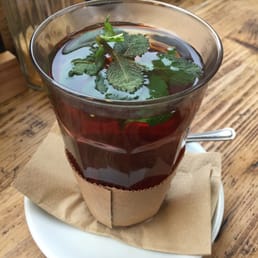 Large glass of hot mint tea. Large glass of hot mint tea.