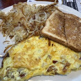 3 egg omelette (cheddar bacon, ham, onion,) hash browns with onions, and white toast. 3 egg omelette (cheddar bacon, ham, onion,) hash browns with onions, and white toast.