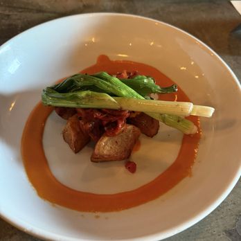 Nunos Bistro & Bar - Side of Patatas Bravas and onions - Modern European Near Me - Upland, California Nunos Bistro & Bar - Side of Patatas Bravas and onions - Modern European Near Me - Upland, California