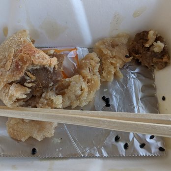 Shanghai Flavor Shop - a piece of food in a container with chopsticks - Shanghainese Near Me - Sunnyvale, California Shanghai Flavor Shop - a piece of food in a container with chopsticks - Shanghainese Near Me - Sunnyvale, California