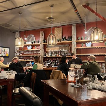 The Wine Bistro - people sitting at a bar - Wine Bars Near Me - Upper Arlington, Ohio