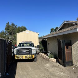 Shed Movers - Carefully maneuvering.