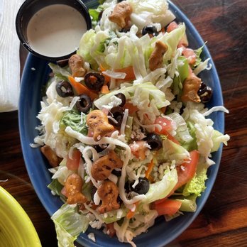 Mutt Lynch's - Ranch salad with little fishy bread snacks on top. - Pubs Near Me - Newport Beach, California