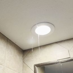 Water dripping from canned lights in room 1047 @ Bluewater Resort during a thunderstorm.