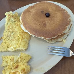 Blueberry pancakes and two scrambled eggs