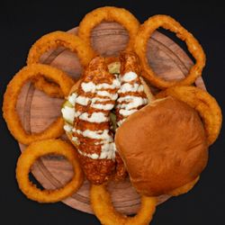 City Burger - The Heights- our hand battered crispy chicken, marinated in our house made City Sauce, topped with tomato, pickle, and our house made ranch!