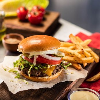 Cheddar's Scratch Kitchen - The Original Burger: Grilled medium-well. Lettuce, tomato, pickles and onions. Served with fries. - American Near Me - Charlotte, North Carolina