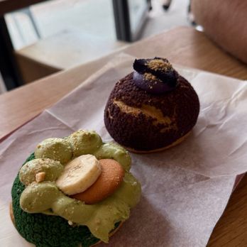 Light on the Sugar - ube and matcha banana cream puff - Bakeries Near Me - Winter Park, Florida Light on the Sugar - ube and matcha banana cream puff - Bakeries Near Me - Winter Park, Florida