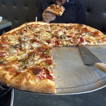 Rocco's Pizza - Dressed pizza - Pizza Near Me - Hollywood, Florida Rocco's Pizza - Dressed pizza - Pizza Near Me - Hollywood, Florida
