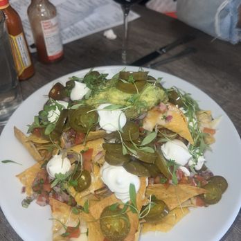 Social Station - Nachos were good, but I appreciate what they did is literally almost every chip had cheese on it in the perfect amount - American Near Me - Henderson, Nevada