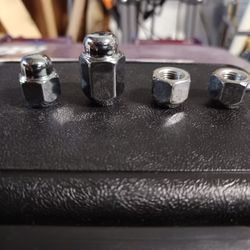Mavis Discount Tire - The left nut is from my car (original), the other 3 are the replacement by Mavis Tire mechanic.