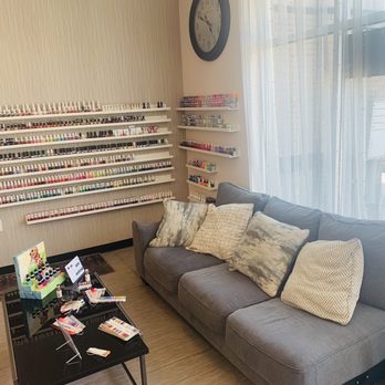 Blossom Nails Spa - Cute sitting/waiting area and nail polish wall - Nail Salons Near Me - Edmond, Oklahoma