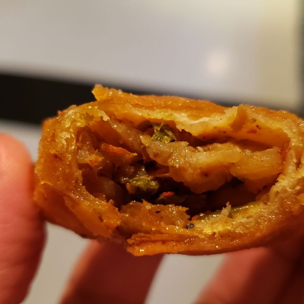 Dilla's - Interior of vegetable sambusa ($8). Oily with weird buttery flavor. - Ethiopian Near Me - Minneapolis, Minnesota