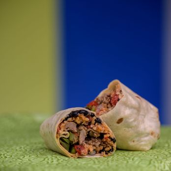 QMart - a burrito cut in half on a table - Tex-Mex Near Me - Houston, Texas QMart - a burrito cut in half on a table - Tex-Mex Near Me - Houston, Texas