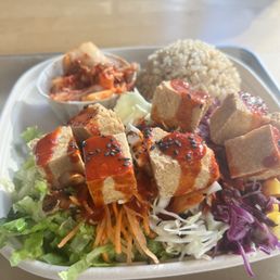 Tofu bibimbap with lettuce base, kimchi and brown rice