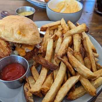 Prost Beer Hall - Hot Pork Schnitzel sandwich and fries - Cocktail Bars Near Me - Elk Grove, California Prost Beer Hall - Hot Pork Schnitzel sandwich and fries - Cocktail Bars Near Me - Elk Grove, California