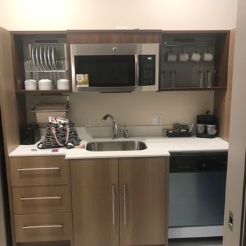 Home2 Suites by Hilton Gilbert - The kitchen and it has settings for 4-6 people. - Hotels Near Me - Gilbert, Arizona