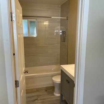 The ADU Guys - a bathroom with a toilet, sink, and tub - General Contractors Near Me