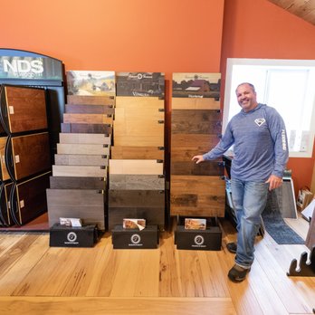 Corner Stone Flooring - a man standing in a store - Flooring Near Me - Annandale, Minnesota