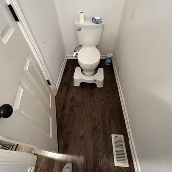 Absolute HomeCare - a toilet in a small bathroom - Flooring Near Me Absolute HomeCare - a toilet in a small bathroom - Flooring Near Me