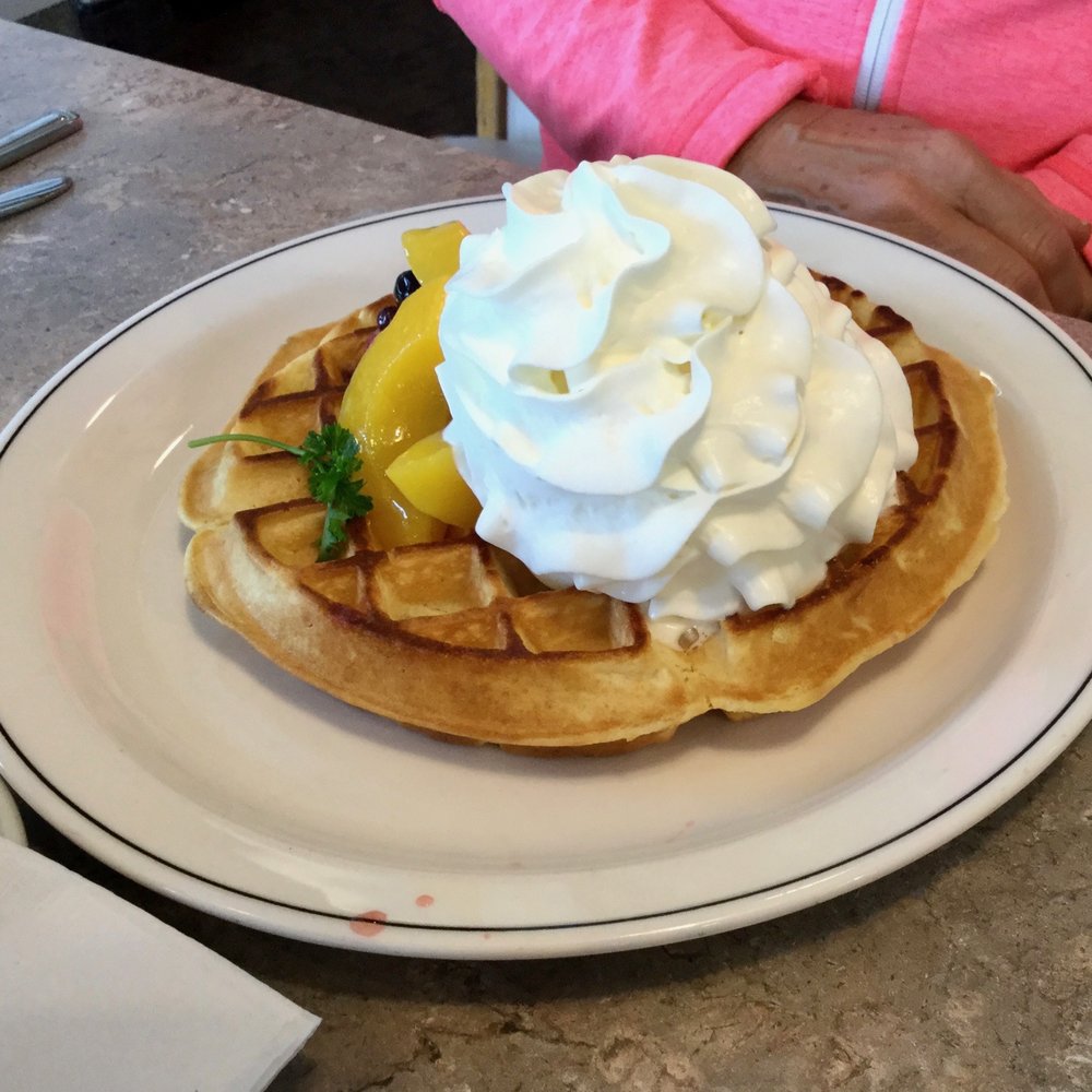 Daughter's waffle w/fruit and whipped cream. Daughter's waffle w/fruit and whipped cream.