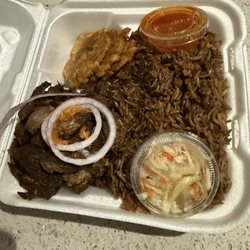 Marie's Kitchen - Cabrit meal with Haitian Black Rice (Djon Djon) and green plantain.