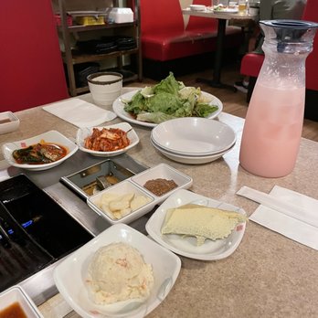 Million Restaurant - The sides for the sets, salad, and Strawberry Soju - Korean Near Me - Honolulu, Hawaii