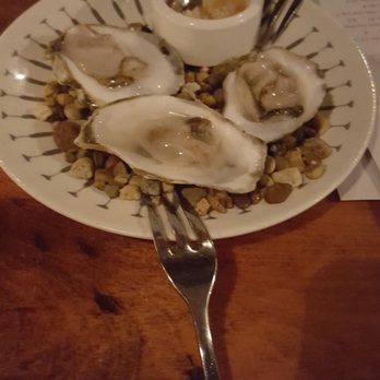 Cobble Hill Restaurant - Oysters on a half shell..on pretty rock display with in house garlic mince - New American Near Me - Cedar Rapids, Iowa