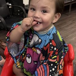 Little Lords & Ladies - Grandson in a car chair at the salon after his cut.