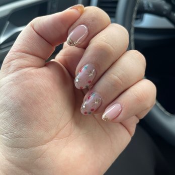 Show Nail - Cutest Christmas set on my natural nails done by Iris! Can't stop staring at my nails at ever red light I stop at - Nail Salons Near Me - North El Monte, California